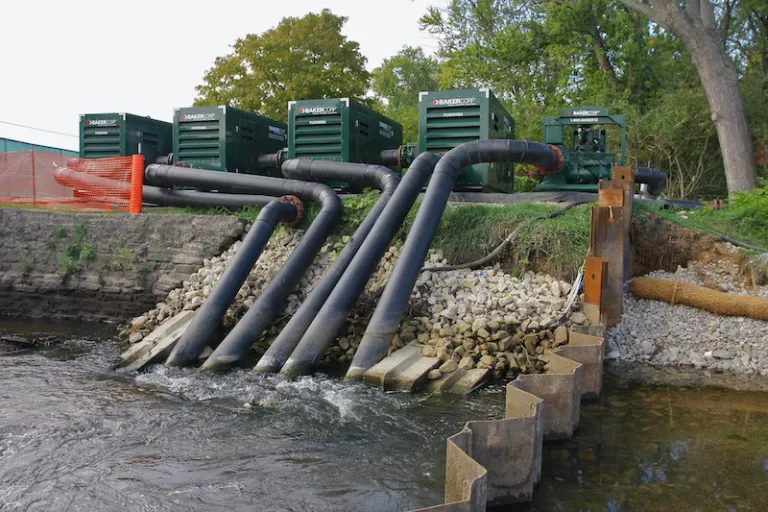 pumps dewatering reservoir from hill