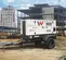 White Wacker-Neuson 38 kW towable generator parked at a commercial construction site