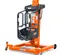 Front angled view of retracted orange and black vertical mast lift with black control panel and safety guard.