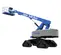 Side view of an extended blue and gray Genie boom lift with elevated platform and tracks.