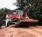 Cargador sobre orugas compacto Takeuchi rojo