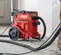 Aspiradora de polvo de concreto, húmedo/seco, eléctrica HILTI roja y negra