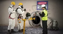 three people with scba masks 