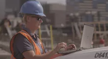 woman on jobsite with laptop